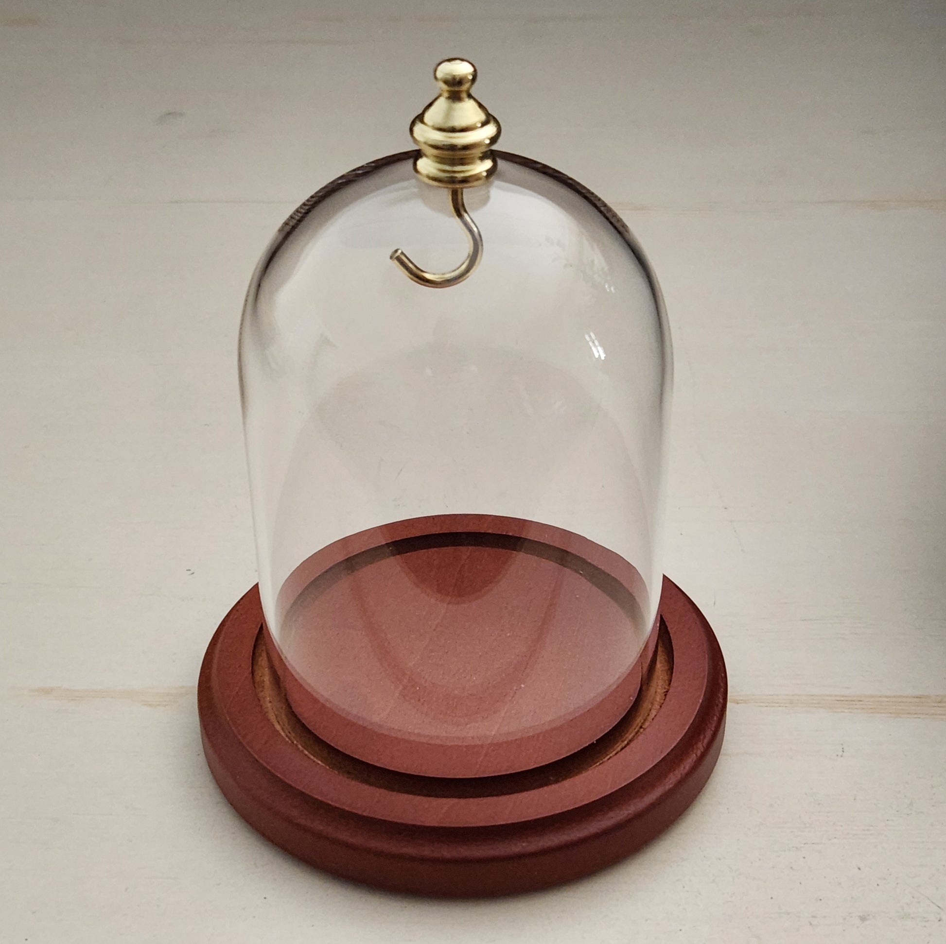 Pocket watch glass display dome cloche gold knob and hook walnut stained base 3"x4", front view.