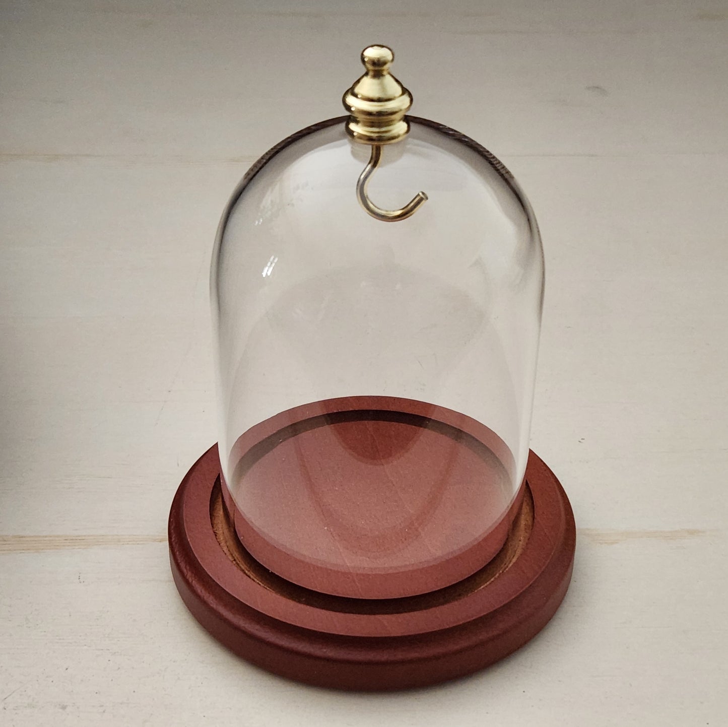Pocket watch glass display dome cloche gold knob and hook walnut stained base 3"x4", back view.