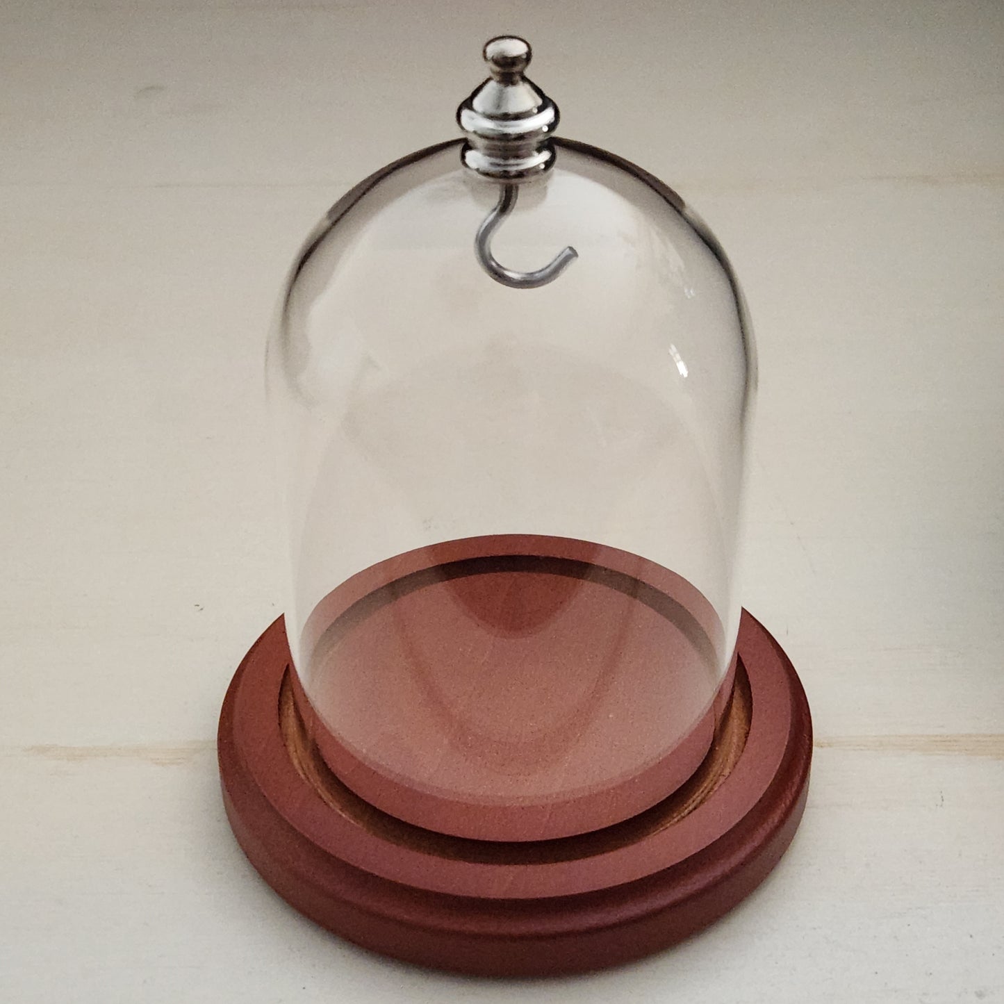 Pocket watch glass display dome cloche silver knob and hook walnut stained base 3"x4", front view.