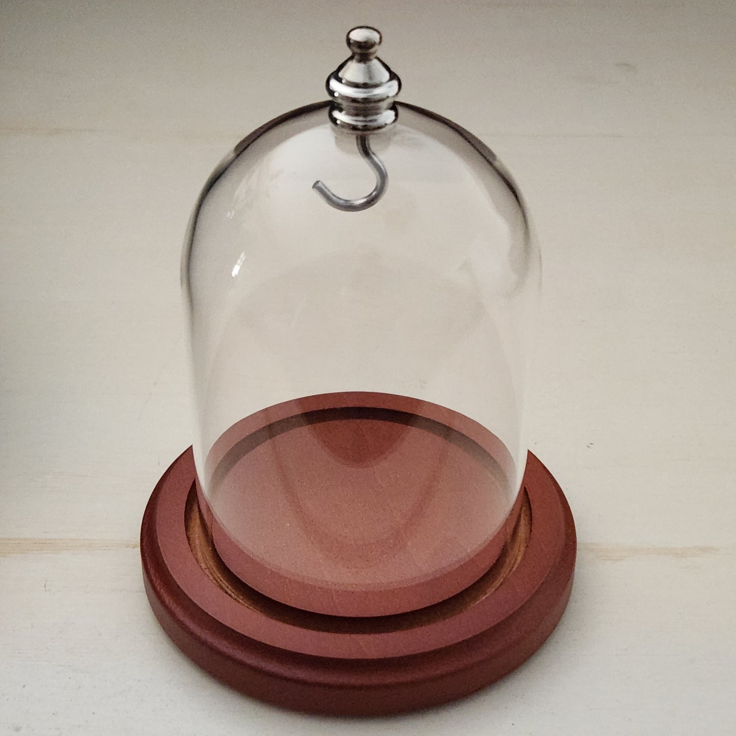 Pocket watch glass display dome cloche silver knob and hook walnut stained base 3"x4", back view.